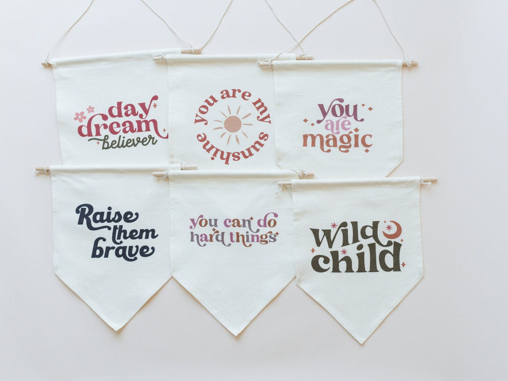 "Daydream Believer Canvas Pennant for nursery wall art, perfect for creating a whimsical baby room decor."