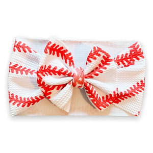 Cute baseball headwrap bow for babies, perfect accessory for hats, socks, and mittens collection.