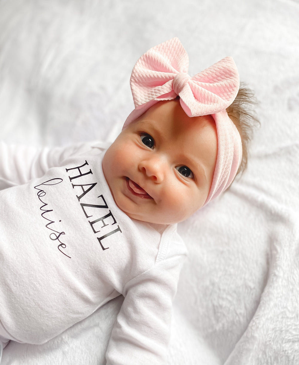 Cute baseball headwrap bow for babies, perfect accessory for hats, socks, and mittens collection.