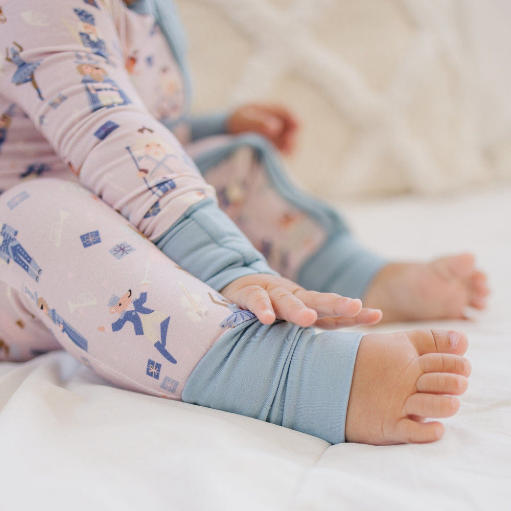 Nutcracker print bamboo zippy romper for newborns, perfect for cozy comfort and style.