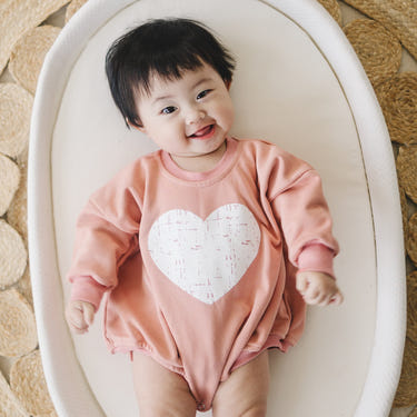 Distressed Heart Sweatshirt Romper in various colors for babies, perfect for comfort and style.