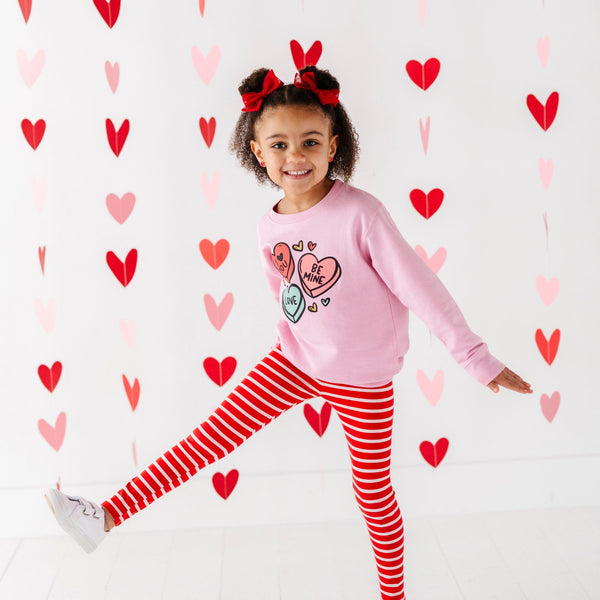Candy Heart's cozy sweatshirt for babies, featuring a playful design, perfect for stylish comfort in any season.