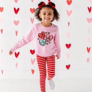 Candy Heart's Sweatshirt for babies, stylish and cozy top, shown from angle 2. Perfect for playful outfits!