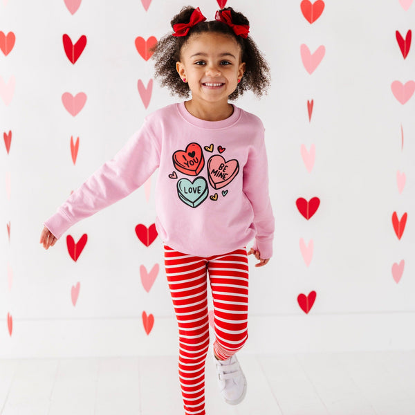 Candy Heart's Sweatshirt for babies, stylish and cozy top, shown from angle 2. Perfect for playful outfits!