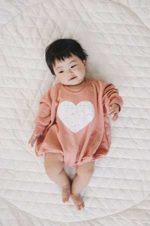 Distressed Heart Sweatshirt Romper in various colors, angle 5 view, perfect for stylish baby outfits.