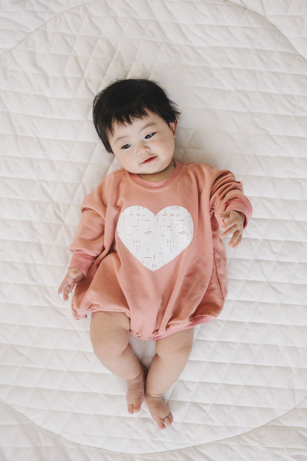 Distressed Heart Sweatshirt Romper in various colors, angle 5 view, perfect for stylish baby outfits.