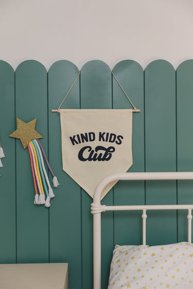 "Kind Kids Club Canvas Pennant - Colorful wall art for kids' rooms, promoting kindness and creativity."