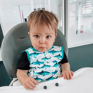 Shark Attack Bapron for babies, featuring a fun shark design, angled view showcasing its unique style and functionality.