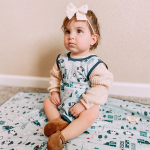 "Be Brave Police Patrol Bapron for babies, featuring a fun police theme, angle view showcasing design and functionality."