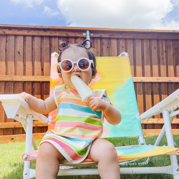 Rainbow Stripes Bapron for babies, featuring a colorful design and practical angle 9 fit for mess-free feeding.