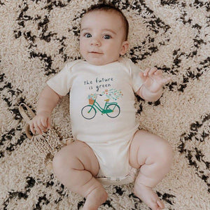 Graphic bodysuit "Future is Green" for babies, short sleeve, stylish design, angle view showcasing vibrant colors.