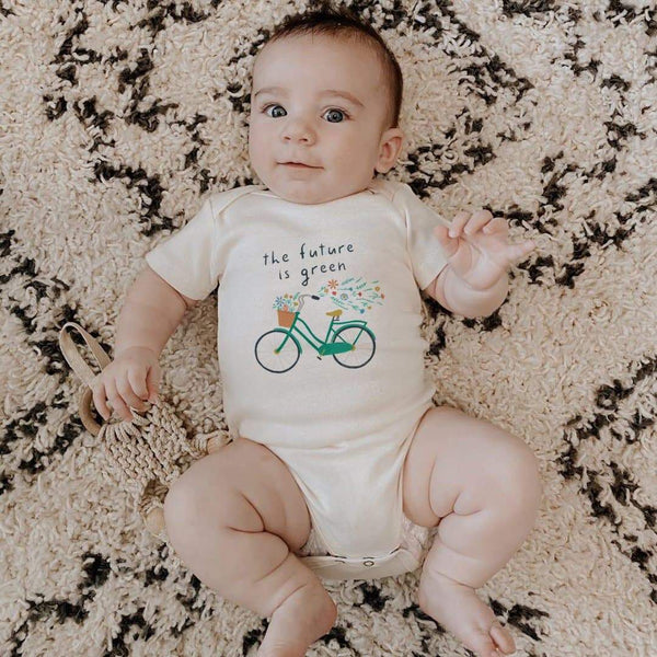 Graphic bodysuit "Future is Green" for babies, short sleeve, stylish design, angle view showcasing vibrant colors.