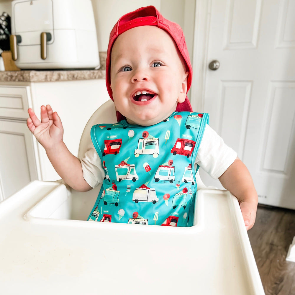 Colorful Ice Cream Truck Bapron for babies, perfect for mess-free mealtime fun and play.