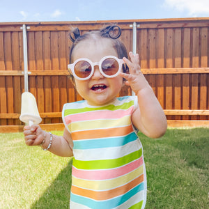 Rainbow Stripes Bapron for babies, angled view showcasing vibrant colors and practical design for mealtime messes.