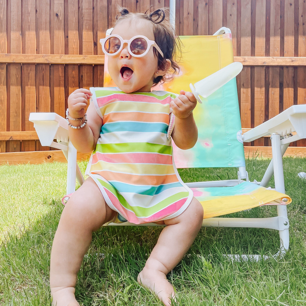 Rainbow Stripes Bapron for babies, featuring a vibrant design and practical, mess-free coverage for mealtime.