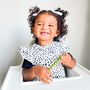 Organic Dot Flutter Bapron for babies, stylish and practical, shown at angle 13.