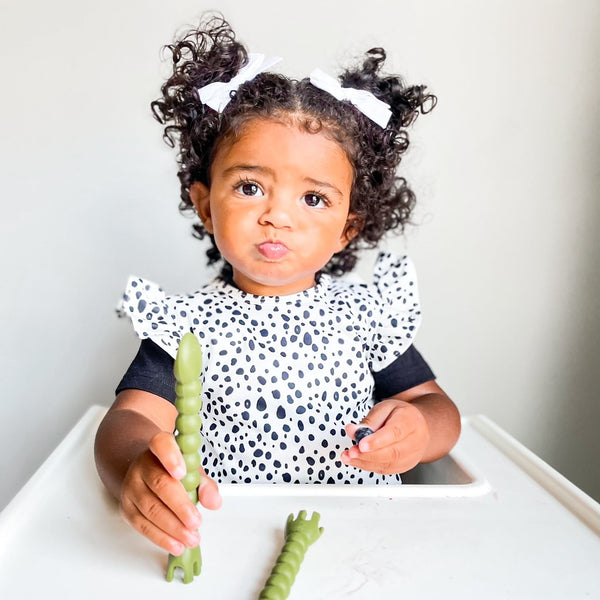 Organic Dot Flutter Bapron for babies, shown from angle 2, featuring a playful design and eco-friendly materials.