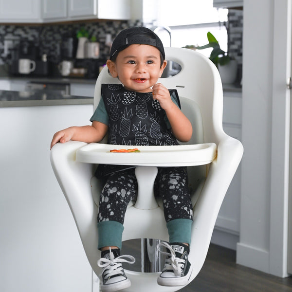 Pineapple monochrome bapron for babies, stylish and practical, shown from angle 2. Perfect for mealtime messes.
