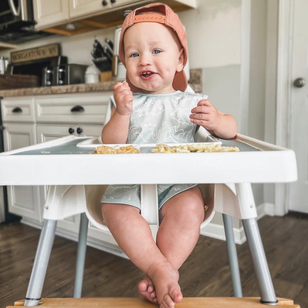 Dino Friends Sage Bapron for preschoolers on sale, angled view showcasing its fun design and practical use.