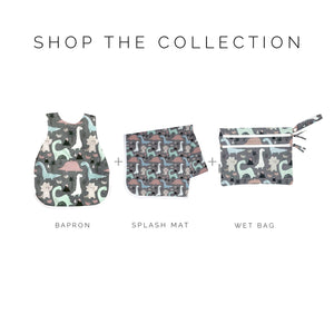 Dinosaur Drawing Bapron for babies, angled view showcasing fun design and practical use during mealtime activities.