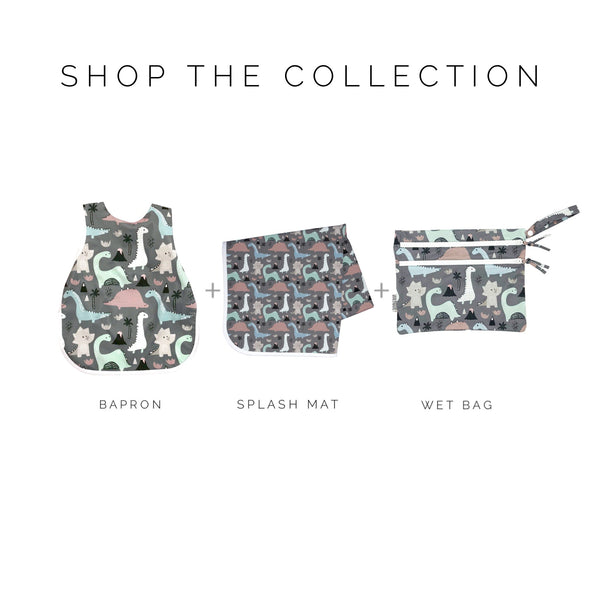 Dinosaur Drawing Bapron for babies, angled view showcasing fun design and practical use during mealtime activities.