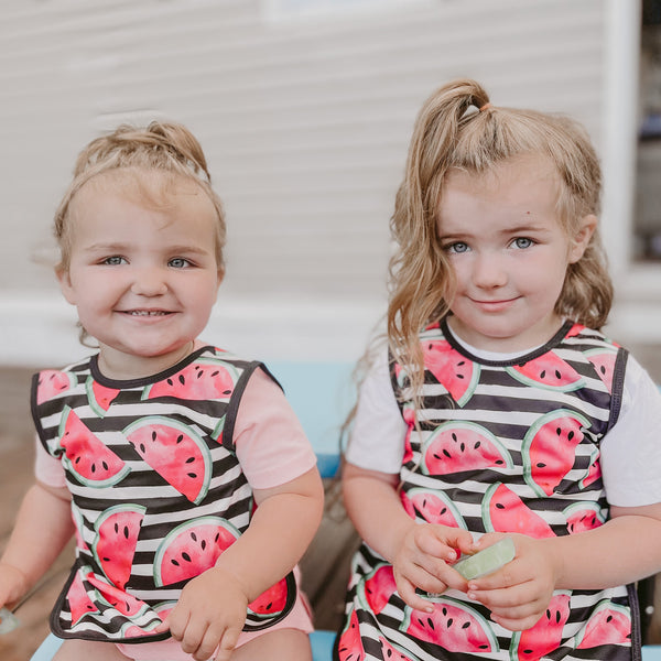 Summer Stripes Watermelon Bapron on sale, angled view showcasing vibrant colors and playful design for babies.