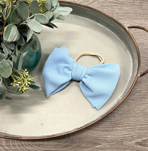 Brilliant Bow Headband for babies, stylish accessory for any outfit, perfect for seasonal wear.