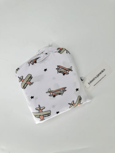Airplane Mode Swaddle for babies, soft and cozy, perfect for safe sleep and comfort.
