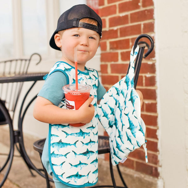 Shark Attack Bapron for babies, angled view showcasing fun design and practical use for mealtime messes.