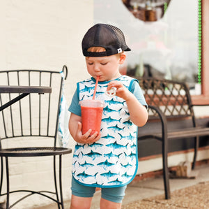 Shark Attack Bapron for babies, featuring a fun shark design, angled view showcasing its unique style and practicality.
