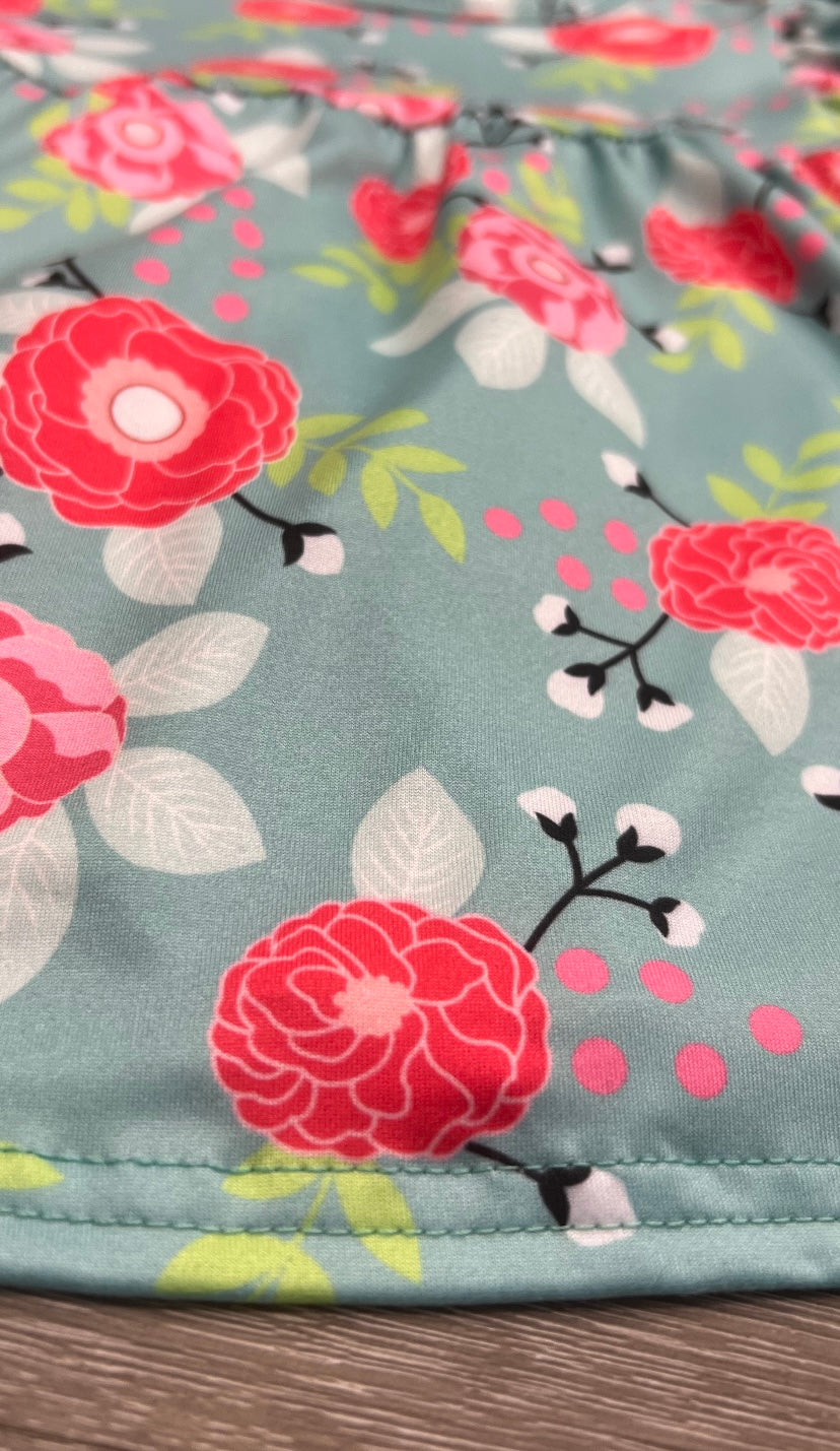 "Blooms Of Pink Dress for babies, featuring floral patterns and a soft, comfortable design."