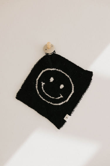 Black & White Just Smile Lovey for babies, featuring a soft design perfect for comfort and cuddling.