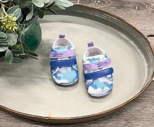 Colorful camo sneakers for babies, stylish and comfortable shoes from angle 3 view. Perfect for little explorers!