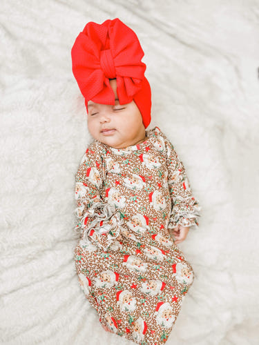 Vintage leopard Santa ruffle gown for babies, perfect for festive playtime and holiday celebrations.