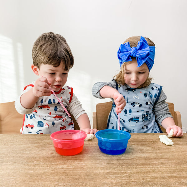 "Be Brave Firefighter Bapron for babies, featuring a fun design at angle 9, perfect for mealtime messes."