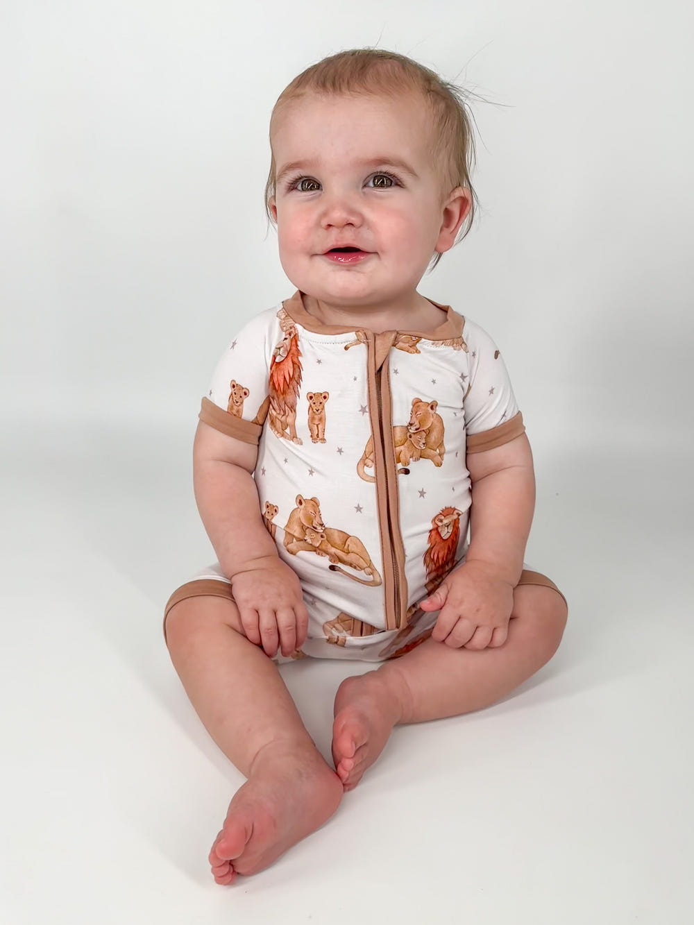 Just Lion Around shorties for babies - cozy sleepsuit and pyjamas featuring a playful lion design.