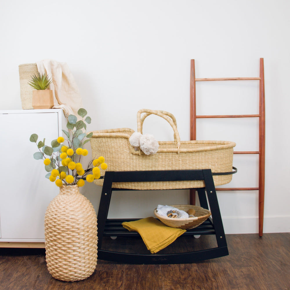 Classic black rocking Moses bassinet stand with brake, perfect for soothing your baby safely.