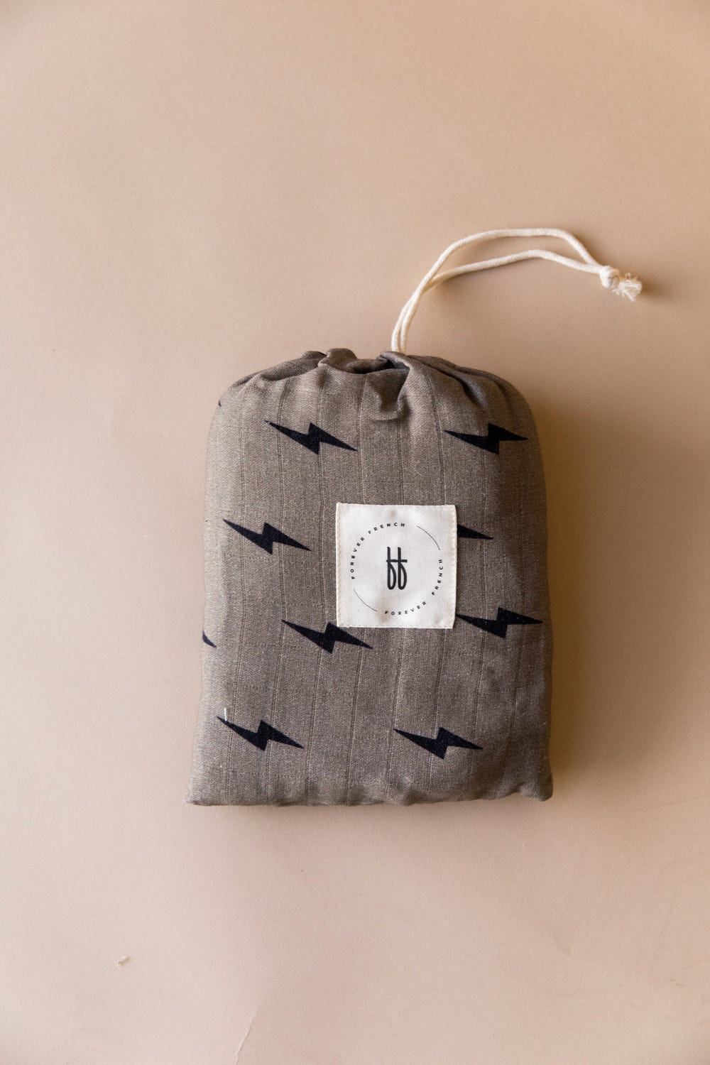 Muslin crib sheet featuring a lightning bolt design, perfect for stylish and cozy nursery decor.