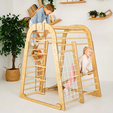 Indoor wooden playground set for kids featuring swings, slide, and 6-in-1 play options. Safe and fun for toddlers.