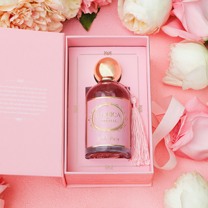 Jude Rose Eau de Parfum by Florica for babies, showcasing a delicate fragrance in an elegant bottle from angle 2.