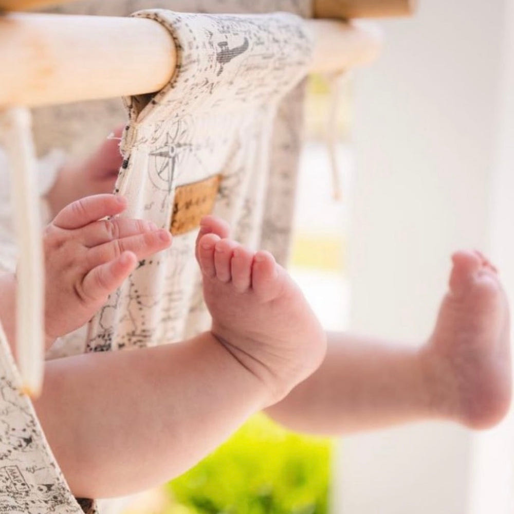Indoor baby swing for soothing and entertaining infants, featuring a safe and comfortable design.