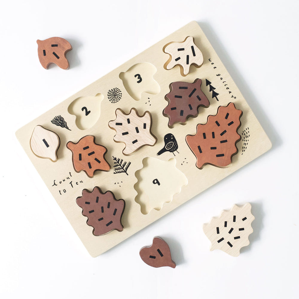 Wooden tray puzzle featuring colorful leaves for counting to 10, perfect for early learning and playtime.
