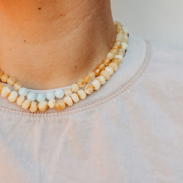 Raw Butterscotch Baltic Amber Necklace for babies, soothing teething relief and stylish accessory.