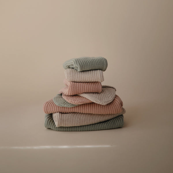 Chunky knit pants for babies, cozy and stylish, shown from angle 10. Perfect for comfort and warmth.