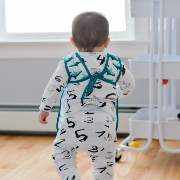 Shark Attack Bapron for babies, angled view showcasing playful design and practical features.