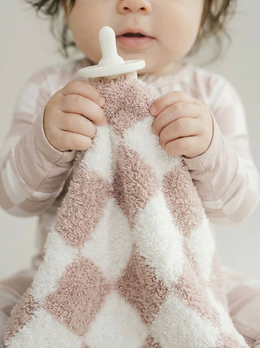 Checkered plush lovey in latte color, perfect for comforting babies and enhancing their cuddly experience.