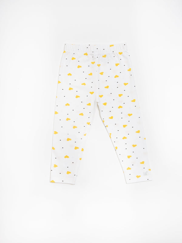 Organic cotton leggings in yellow hearts pattern, angle view, perfect for babies and toddlers.