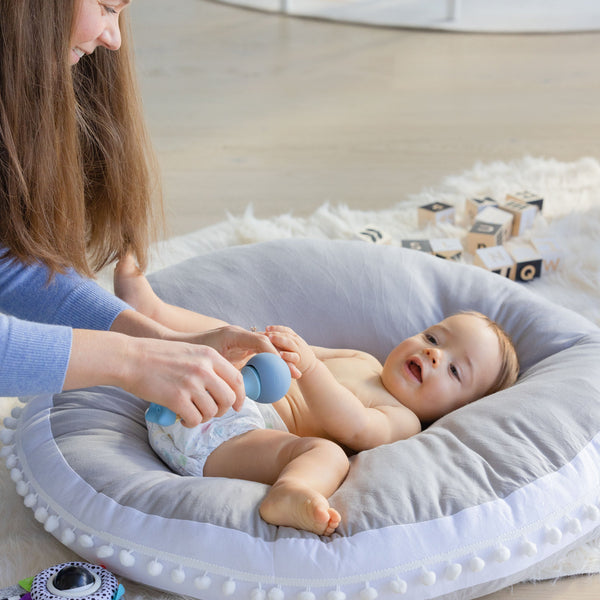 Complete Baby Massager for soothing and relaxing infants, angle view showcasing its ergonomic design and soft textures.