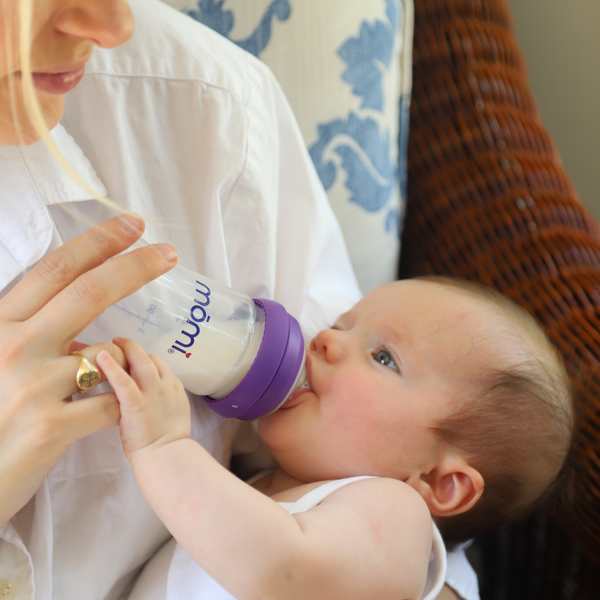 Mōmi on-the-go bundle 4oz baby bottles, angled view showcasing sleek design and portability for feeding convenience.