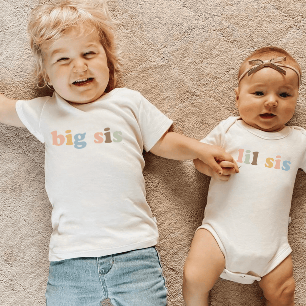 Lil Sis Desert Bloom graphic bodysuit for babies, short sleeve, perfect for stylish and comfortable wear.
